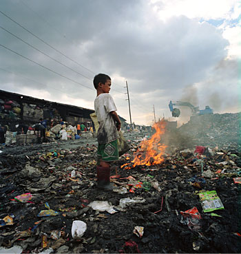 Misty Keasler, Burning Wires, Pier 15, Manila, from the series 'Garbage Dumps and Nearby Communities in Manila,' 2006, C-print, 19 x 19 inches, Copyright the artist and courtesy of Photographs Do Not Bend Gallery (Dallas, TX)